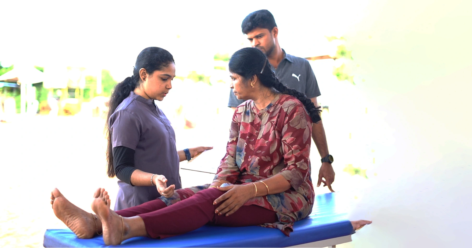 Physiotherapists treating a patient